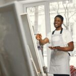 Black artist painting abstract