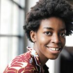 black woman typing laptop