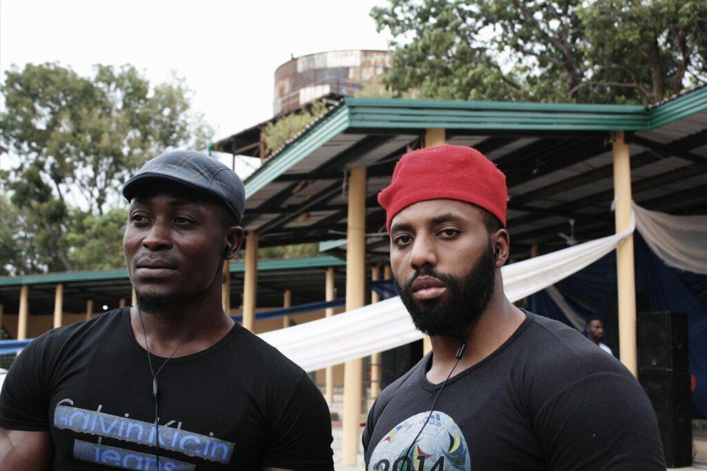 diverse african actors watching tv