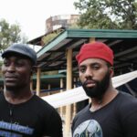 diverse african actors watching tv