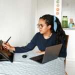 freelance artist working on digital tablet