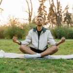 person meditating sunrise