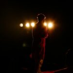actor on stage spotlight
