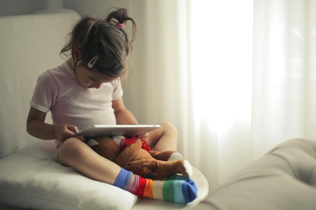 child using tablet positively