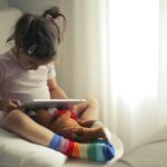 child using tablet positively
