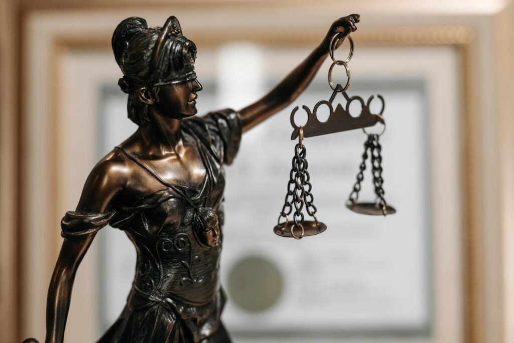 courtroom scales of justice and media symbols