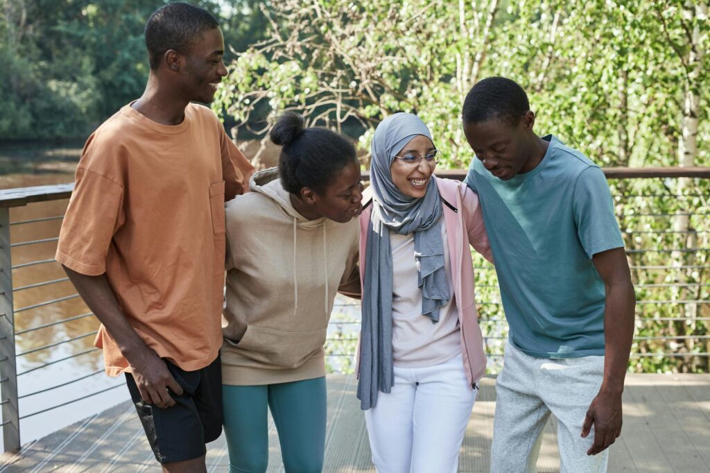 diverse group of young people watching streaming