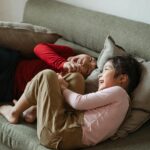 family laughing in living room lifestyle photo