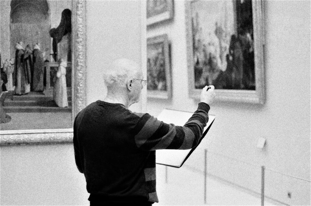 person appreciating painting