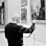 person appreciating painting