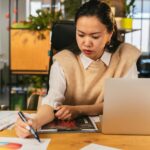woman analyzing blog analytics