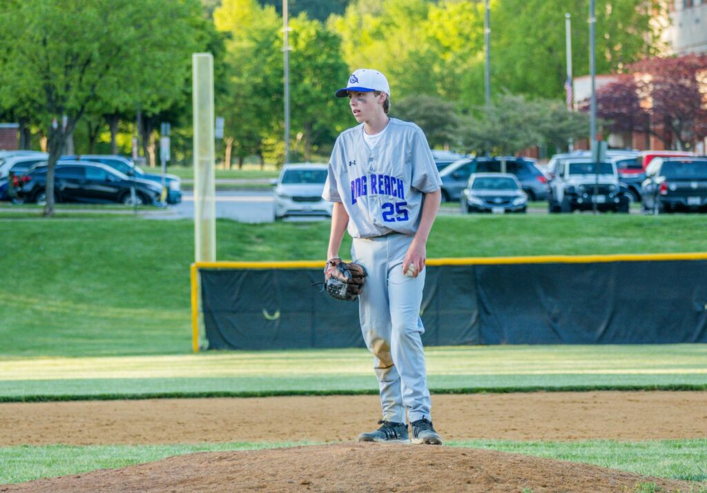 young baseball pitcher throwing