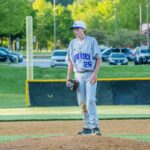young baseball pitcher throwing