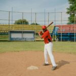 young baseball player with coach